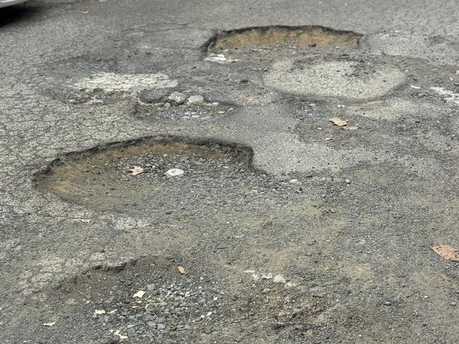 Potholes in Bankstown CBD. You would think the local council had more pressing issues than chasing a state-based Voice. Picture: Amaani Siddeek