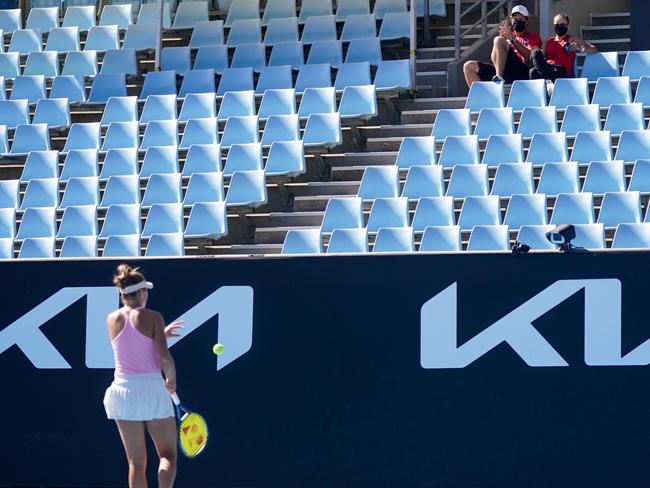 Ash Barty watches Olivia Gadecki at Melbourne Park in 2021, mentor Barty was the first to text congratulations after the round one victory. Picture: Tennis Australia/Natasha Morello