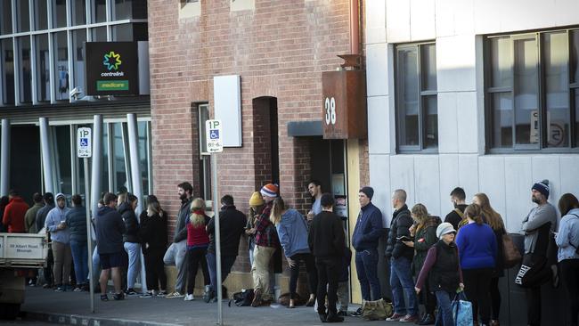 People line up outside the Centrelink office in Hobart to apply for the JobKeeper payment. Picture: CHRIS KIDD