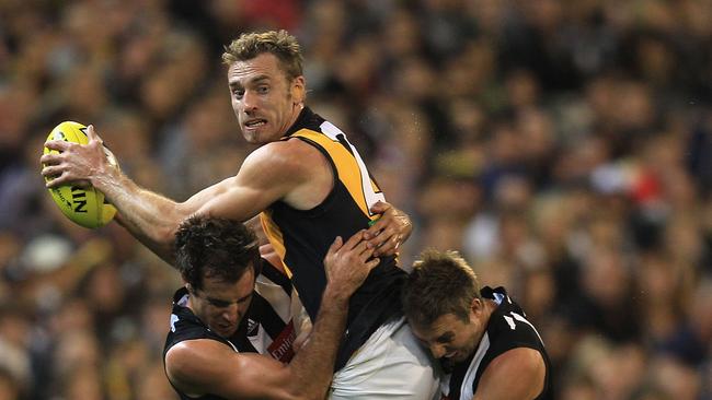 20 JULY 2020 - Former AFL footballer Shane Tuck has died at the age of 38. Tuck played 173 matches for the Richmond Tigers between 2004 and 2013. MELBOURNE, AUSTRALIA - APRIL 07:  Shane Tuck of the Tigers tries to break free during the round two AFL match between the Collingwood Magpies and the Richmond Tigers at the Melbourne Cricket Ground on April 7, 2012 in Melbourne, Australia.  (Photo by Hamish Blair/Getty Images)