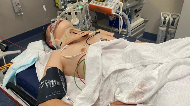 A 15-year-old boy is in an induced coma after he was knocked unconscious by a gang of youths.