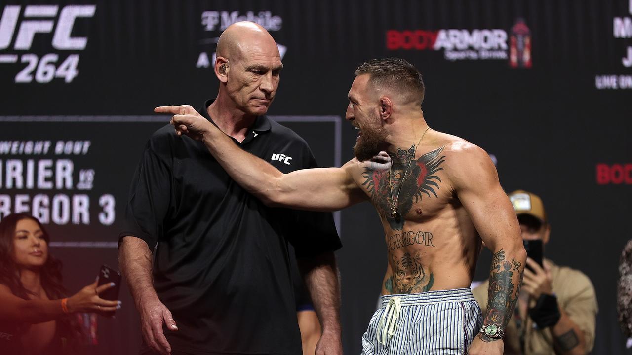 LAS VEGAS, NEVADA - JULY 09: Conor McGregor is restrained during a ceremonial weigh in for UFC 264 at T-Mobile Arena on July 09, 2021 in Las Vegas, Nevada. Stacy Revere/Getty Images/AFP == FOR NEWSPAPERS, INTERNET, TELCOS &amp; TELEVISION USE ONLY ==