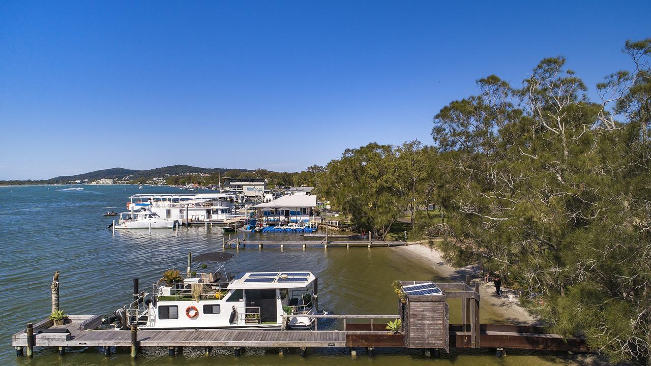 The new owners of this Noosa River jetty and houseboat will enjoy waking up on the waterfront to the remarkable sunrises. Picture: Jason Smith Photography.