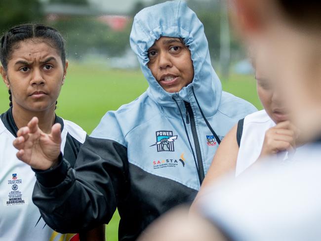 Football coach Bronwyn Davey instructs members of Port Adelaide’s Women’s Aboriginal AFL Academy during their match against New Zealand’s youth squad in Auckland in November, 2018. She is pictured next to her daughter and promising young footballer, Tesharna Maher. Picture: Mark Piovesan.