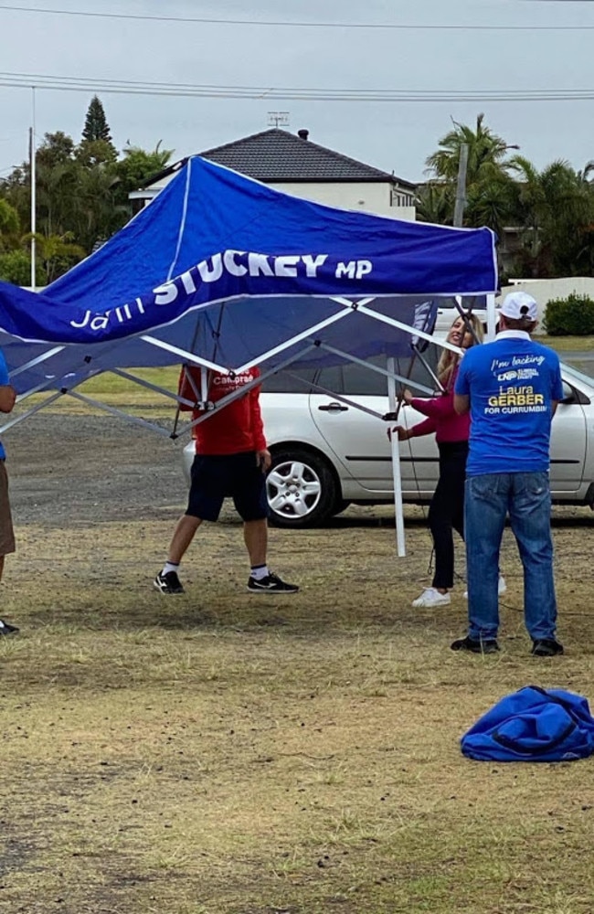 Laura Gerber and campaign workers erecting a marquee, emblazoned with ‘Jann Stuckey MP’, at the Tugun pre-polling booth.