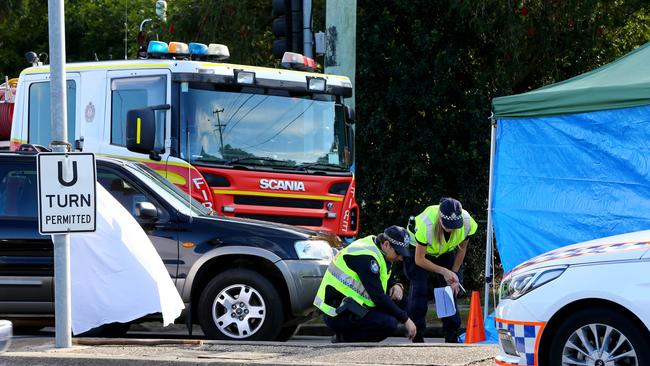 Police at the scene where a female pedestrian died. Picture: AAP/David Clark