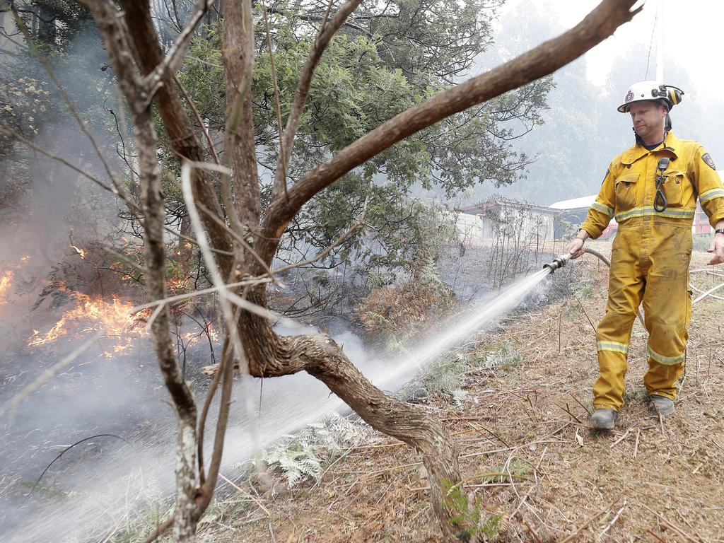 Conducting a back-burn at the top of Donnellys Rd, Geeveston, to protect a house. Picture: RICHARD JUPE