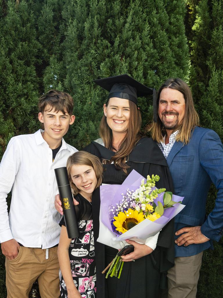 South Burnett Regional Council Cr Kirstie Schumacher celebrates her Bachelor of Communication and Media with son Decklan, daughter Grace and husband Wayne Schumacher at a UniSQ graduation ceremony at Empire Theatres, Tuesday, June 27, 2023. Picture: Kevin Farmer