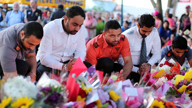 Former taxi driver colleagues at the memorial. Pic: Jack Tran