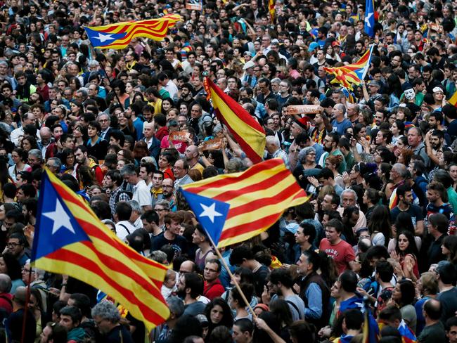 People gather to celebrate the proclamation of a Catalan republic at the Sant Jaume square in Barcelona on October 27. Picture: Pau Barrena/AFP