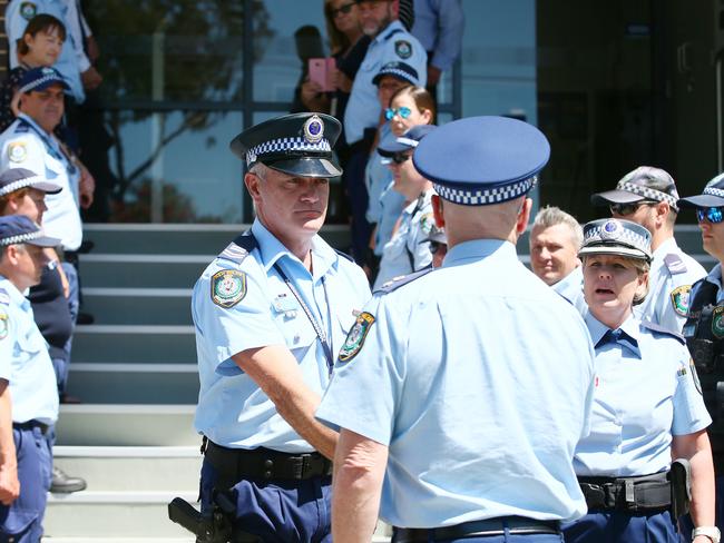 Sen Con Pearce is presented to Superintendent John Gralton to excuse him of his duty. (AAP Image/Sue Graham)