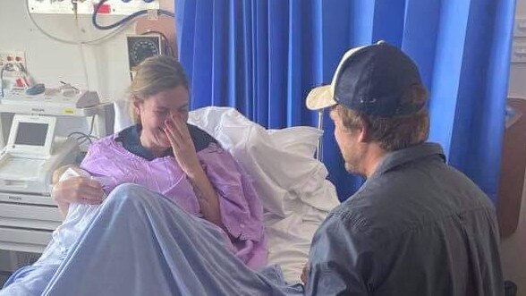 ON BENDED KNEE: The moment Gympie nurse Kristy Bunter gets proposed to at work by Nathan Johnston.