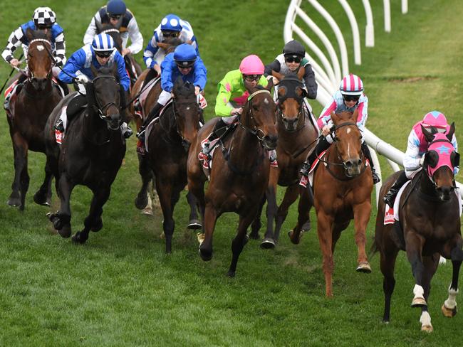 Stephanie Thornton guides home Here To There (right) as the field enters the home straight before winning race eight. Picture: Getty Images