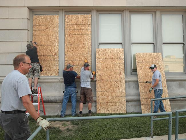 Windows are boarded up at a school near the Kenosha County Court House after a night of protests. Picture: Getty Images/AFP