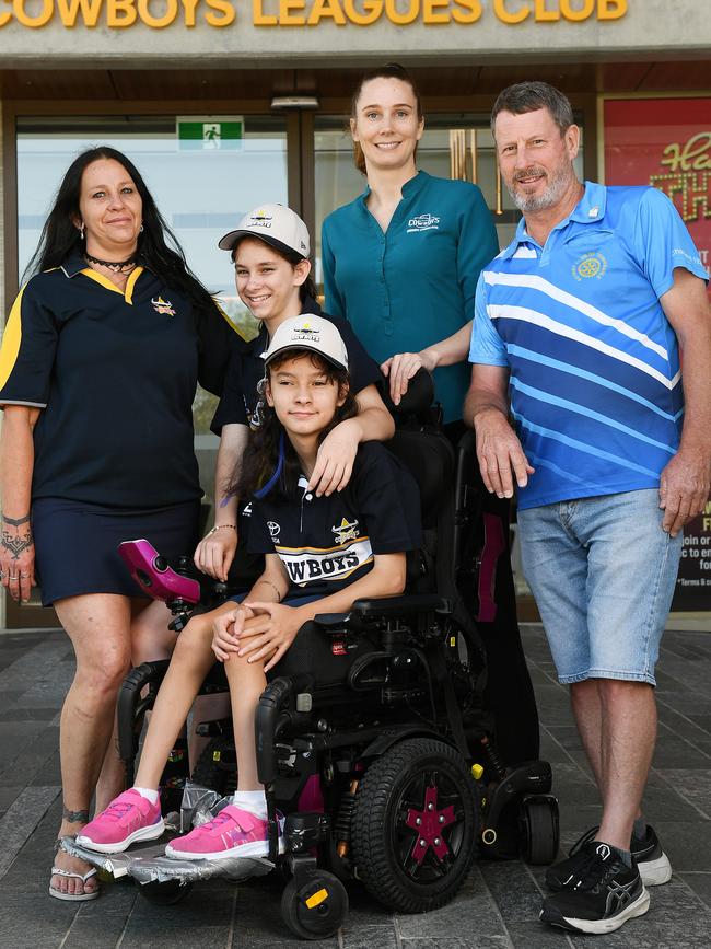 Kelly Christie with her twin girls Sonja Christie, 12, and Skyla Christie, 12, pictured with Helen Smyth, business development manager Cowboys Leagues Club and Guy Raffe, Rotary Club of Townsville president. Picture: Shae Beplate.