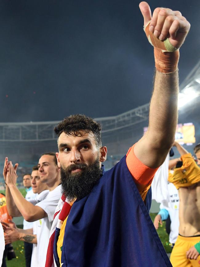 Australia's Mile Jedinak salutes the crowd after his team defeated Honduras in their 2018 World Cup qualification playoff match at Stadium Australia in Sydney. Picture: AFP