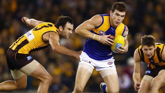 Luke Shuey gets away from Jordan Lewis. Picture: Michael Klein