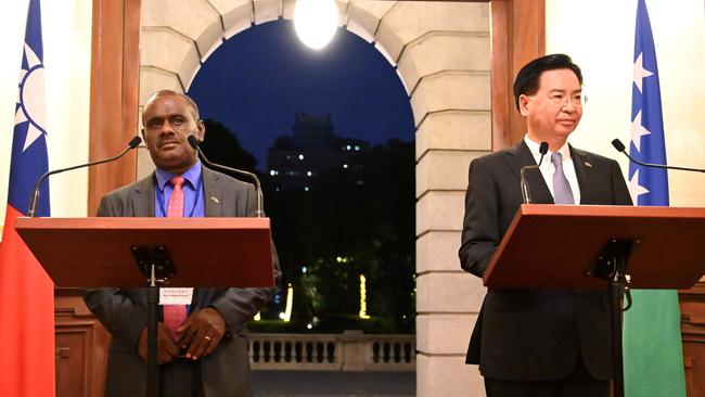 Taiwan’s Foreign Minister Joseph Wu (R) with Solomon Islands' Foreign Minister Jeremiah Manele (L) at the Taipei Guest House in Taipei in 2019.