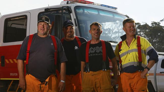 Brighton firefighters on duty at Miena yesterday were Dean Plummer, left, Jason McKenzie, Ben Morice and Danny Pross. Picture: MATT THOMPSON