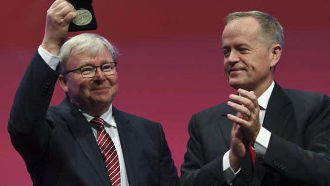 Kevin Rudd is congratulated by Bill Shorten after receiving Labor Life Membership. Picture: AAP. 