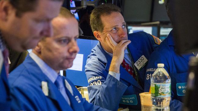 Traders work on the floor of the New York Stock Exchange shortly after the opening bell in New York, October 28, 2015. REUTERS/Lucas Jackson
