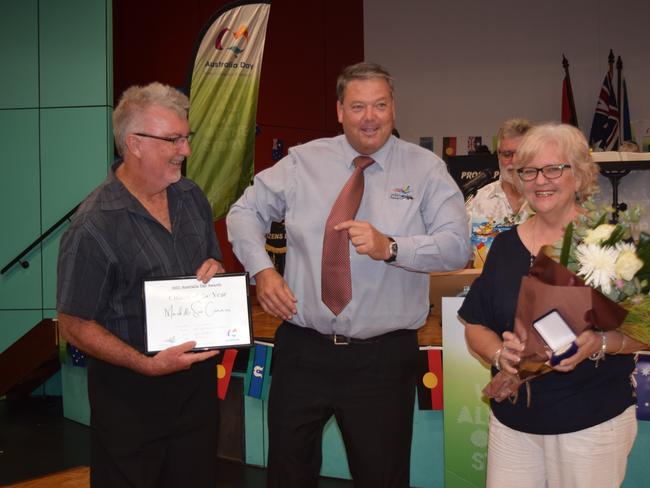 Whitsunday Mayor Andrew Willcox (centre) with 2021 Citizens of the Year for Airlie Beach, Cannonvale, Proserpine and surrounds Mark and Sue Connors. Photo: Elyse Wurm