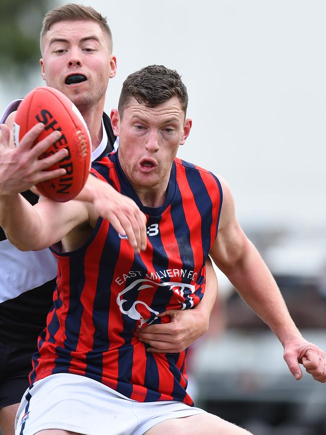 Chris Carey gathers the ball for East Malvern.