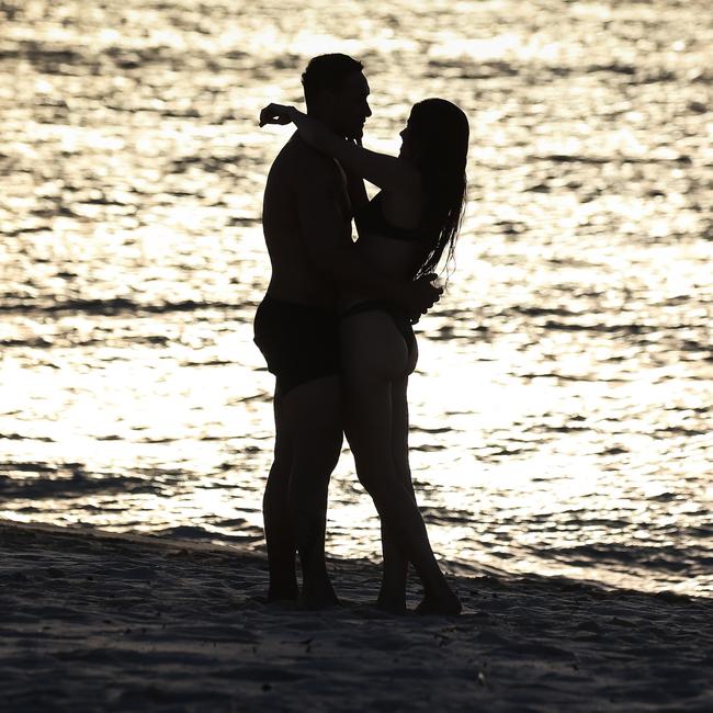 A couple embrace at Bondi Beach on New Year’s morning. Picture: Newscorp Daily Telegraph / Gaye Gerard