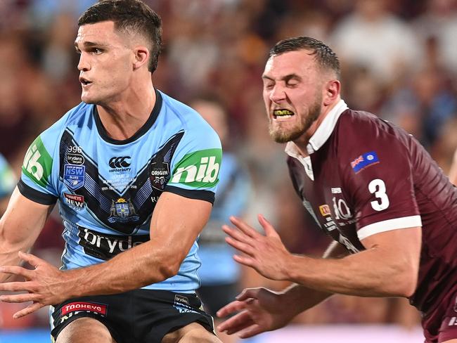 BRISBANE, AUSTRALIA - NOVEMBER 18: Nathan Cleary of the Blues is tackled by Kurt Capewell of the Maroons during game three of the State of Origin series between the Queensland Maroons and the New South Wales Blues at Suncorp Stadium on November 18, 2020 in Brisbane, Australia. (Photo by Bradley Kanaris/Getty Images)