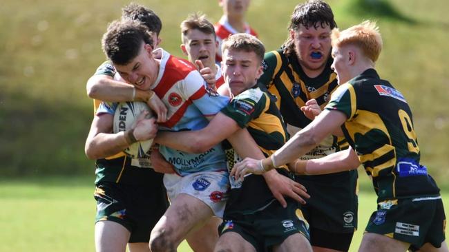 Sam England of the Milton-Ulladulla Bulldogs trying to bust a tackle. Photo: Contributed