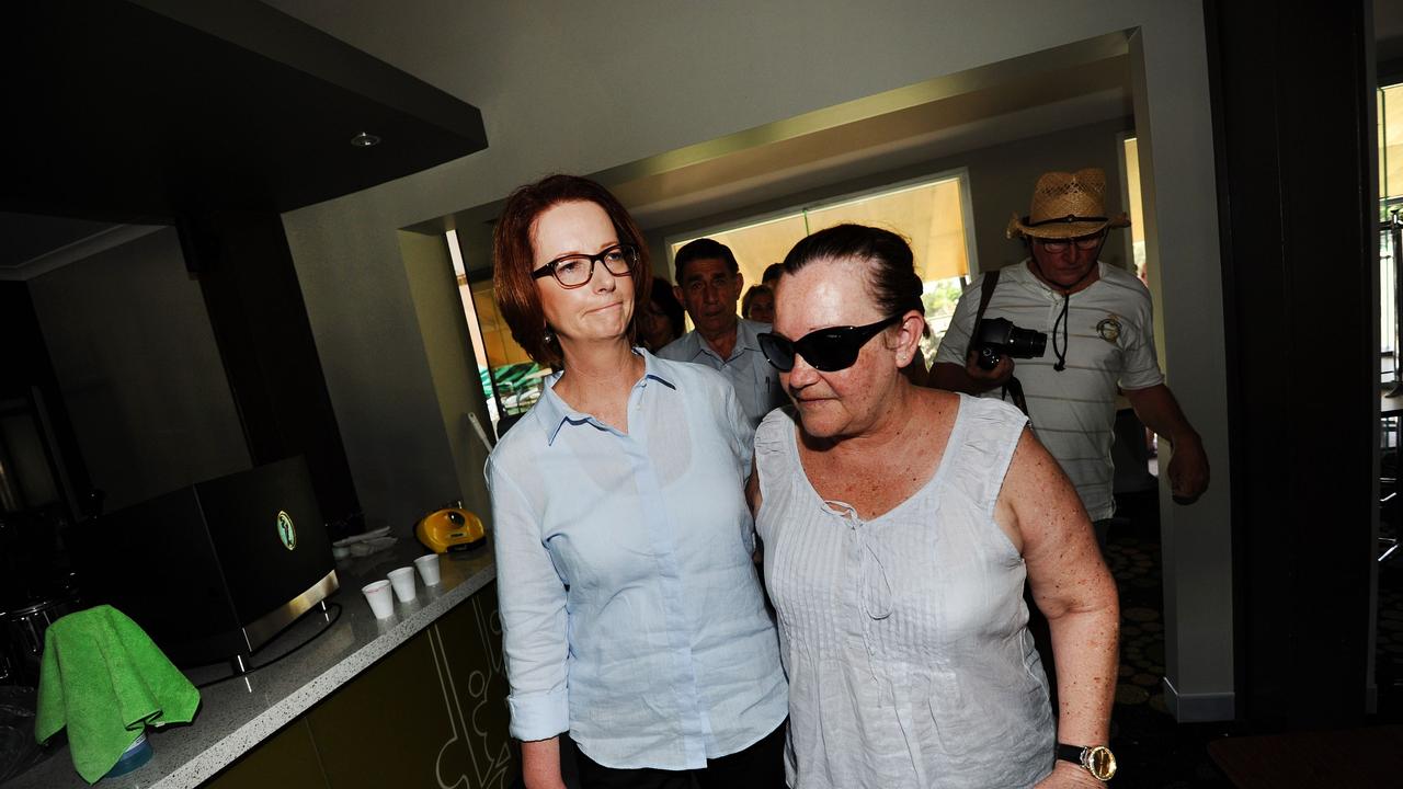 News - BCM - Courier Mail - 31.1.2013 - Bundaberg Flood - Prime Minster Julia Gillard &amp; Bargara Bowls club manager Janelle Fielding walk thru the club after it was wrecked in the freak Tornado. Photo Paul Beutel