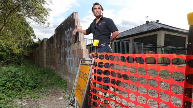 Chris Cassar fears the structural integrity of his wall has been compromised by slumping council land. Picture: Glenn Hampson.