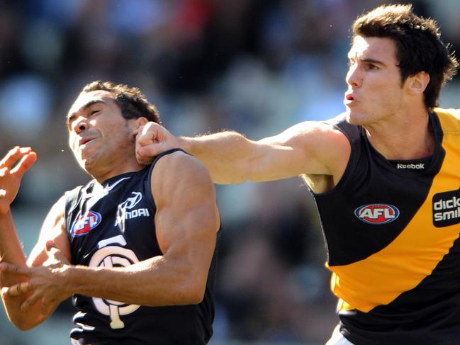 Richmond's David Gourdis tackles Eddie Betts of Carlton, during their round 20 match of the AFL season, played at the MCG, in Melbourne, Saturday, Aug. 14, 2010. (AAP Image/ Joe Castro) NO ARCHIVING, EDITORIAL USE ONLY