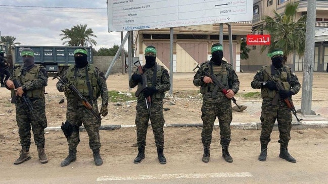 Masked Hamas militants at the release of Israeli hostages in Gaza. Picture: agencies