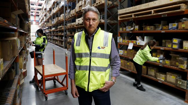 Alchin Long Group chief executive Nigel Long at the company’s Wetherill Park warehouse in Sydney. The company’s supplies are being delayed because of the MUA's industrial action at ports across the country. Picture: Nikki Short