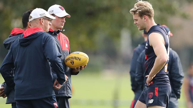 Jack Watts speaks to coach Simon Goodwin an medical staff.