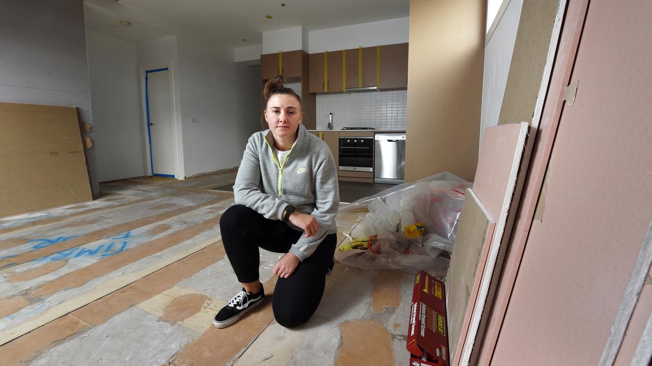 Steph Webb in a ripped up apartment undergoing reconstruction. Picture: Nicki Connolly/news.com.au