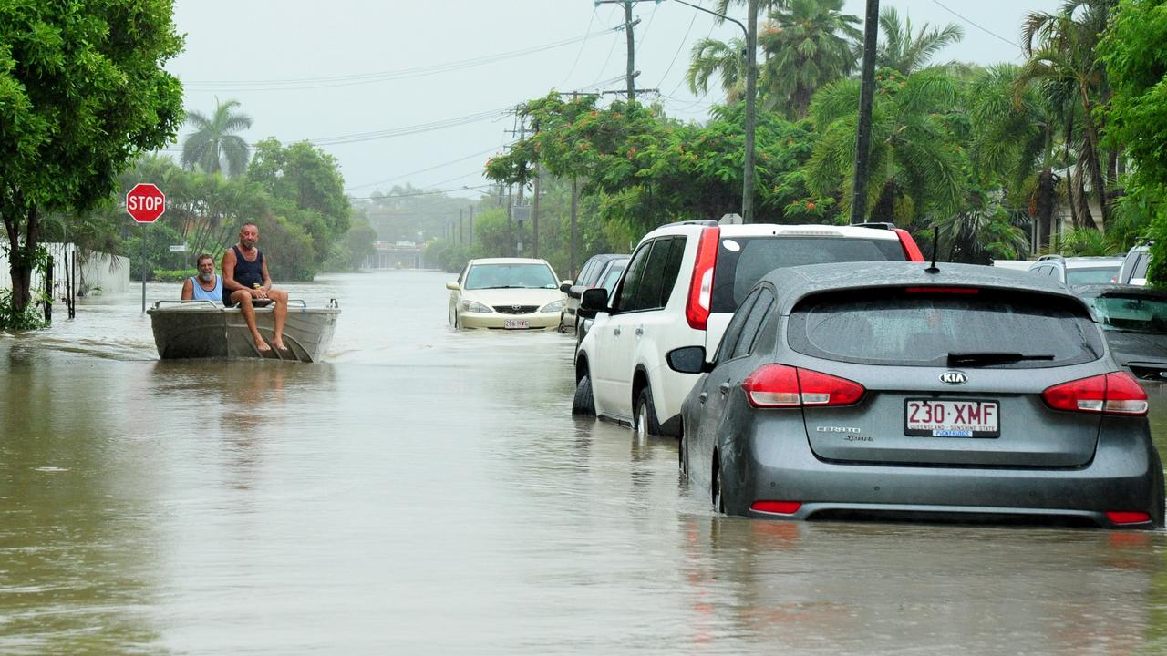 Townsville Floods 2019. A tinnie punts down Carr Street, Hermit Park. Picture: Evan Morgan