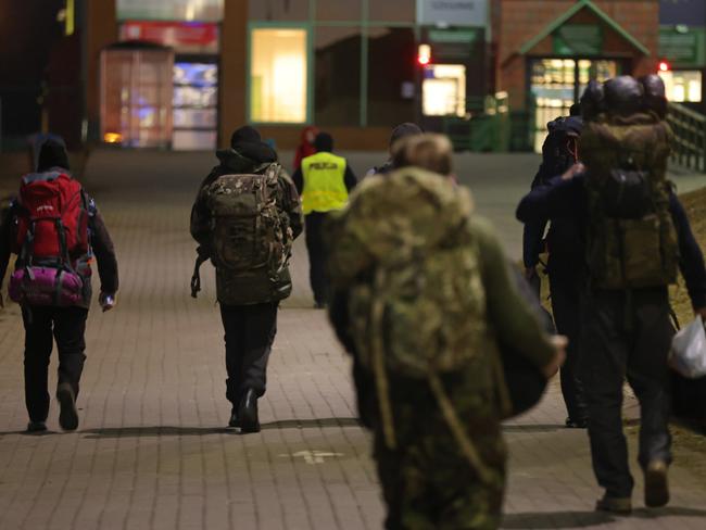 The traffic between Poland and Ukraine has been going both ways, with refugees fleeing the fighting and volunteers, like these, heading towards the conflict to join the invaded country’s “foreign legion”. Picture: Getty Images