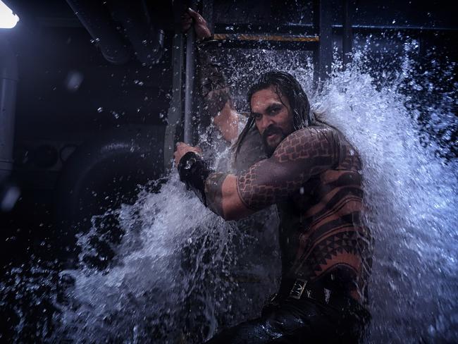 Aquaman begins with our hero, Arthur Curry (Momoa) storming a submarine that is under attack by pirates. Picture: Warner Bros