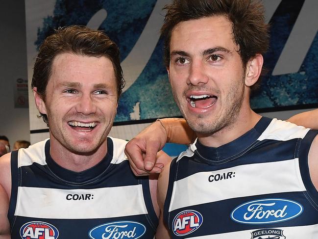 (L-R) Jed Bews, Patrick Dangerfield and Daniel Menzel of the Cats sing the club song after winning the Round 14 AFL match between the Geelong Cats and the Fremantle Dockers at Simonds Stadium in Geelong, Sunday, June 25, 2017. (AAP Image/Julian Smith) NO ARCHIVING, EDITORIAL USE ONLY