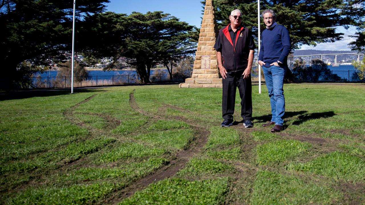 President of the Lindisfarne RSL Sub branch Chris Parker and City of Clarence Mayor, Brendan Bromeley survey the damage left to Anzac Park overnight. Picture: Linda Higginson