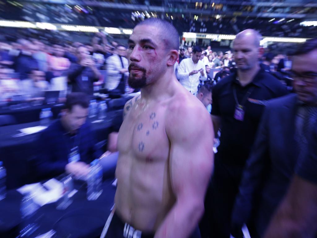 Whittaker leaves the Octagon after his first loss to Adesanya in 2019. Picture: Darrian Traynor/Getty Images