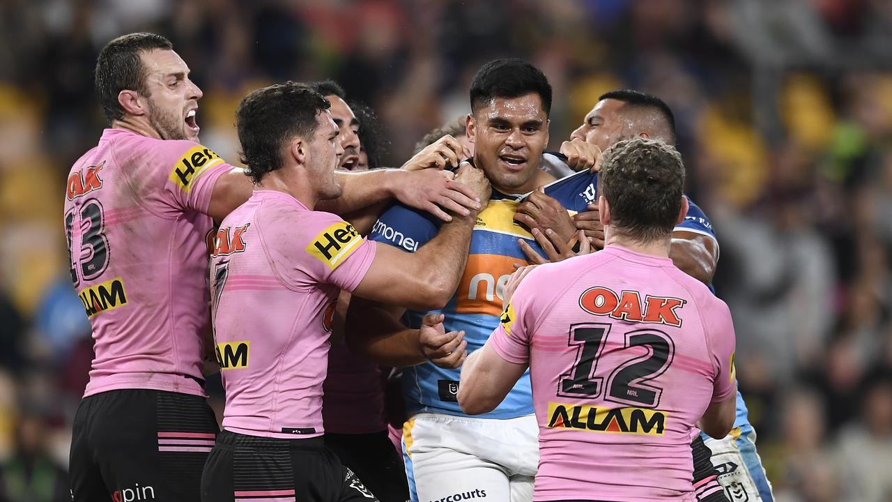 BRISBANE, AUSTRALIA - MAY 16: Herman Ese'ese of the Titans is confronted by Panthers players after Herman Ese'ese performed a dangerous tackle against Brian To'o of the Panthers during the round 10 NRL match between the Gold Coast Titans and the Penrith Panthers at Suncorp Stadium, on May 16, 2021, in Brisbane, Australia. (Photo by Albert Perez/Getty Images)