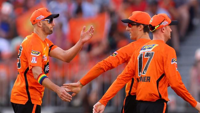 Andrew Tye, Ashton Turner and Nick Hobson enjoy a wicket.