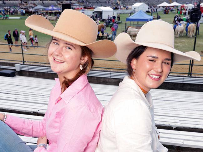 L to R, Alexandra Olive and Libby Perkins , both from Rockhampton watching the Murray Greys being judged, at the EKKA, the Brisbane Exhibition at the RNA, Bowen Hills, Saturday 10th August - Photo Steve Pohlner