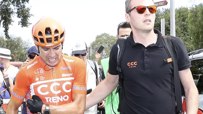 CYCLING - Tour Down Under - Stage 5 - Glenelg to Strathalbyn. The Ochre Jersey of Patrick Bevin walks to an ambulance after crashing at around the 10km from the finish. Picture SARAH REED