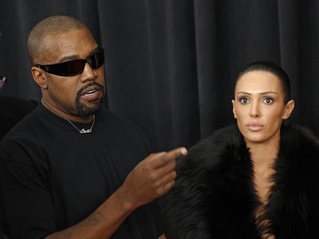 A former Yeezy designer has accused Bianca Censori (R) of threatening behaviour at the clothing company owned by her husband Kanye West (L). Picture: Frazer Harrison/Getty Images