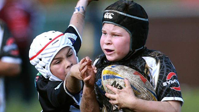 Out of my way ... Rhinos under-10 player on the charge.