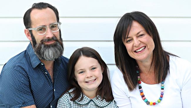 Harper Nielsen, 9, (centre), with her parents Mark Nielsen and Yvette Miller. (Pic: Annette Dew)